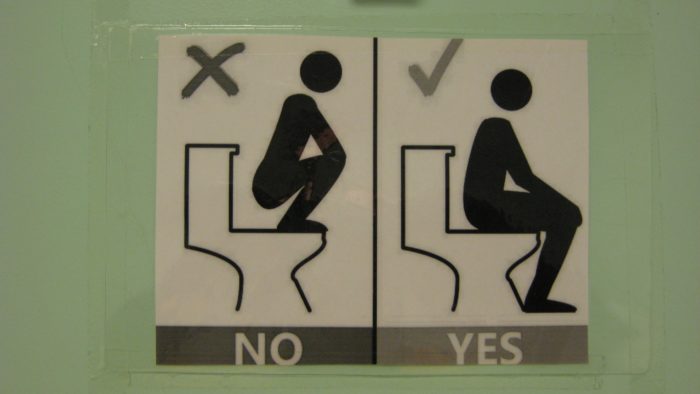 Sign of Dos and Don'ts at toilet