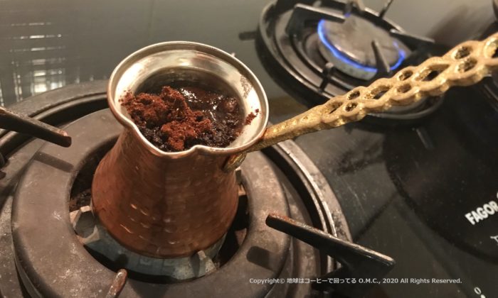 Coffee powder mixed into hot water in Ibrik